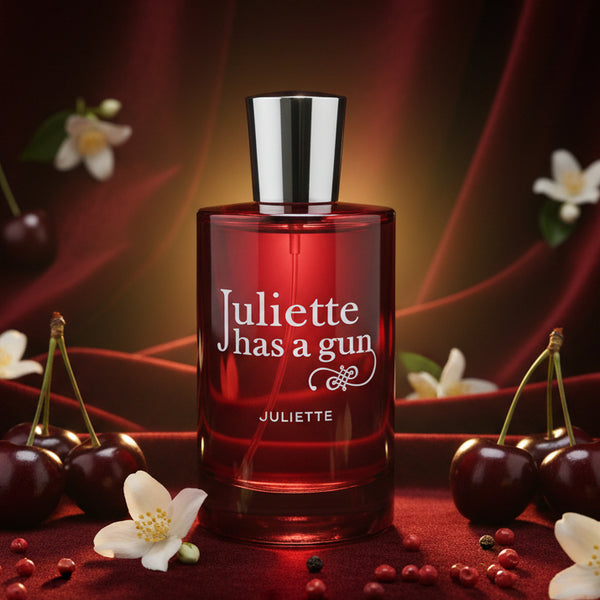 Juliette has a gun perfume bottle with silver cap and red glass.