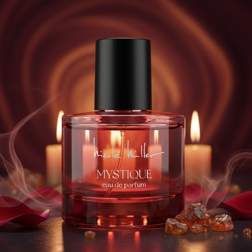 Nicole Miller Mystique eau de parfum in a red glass bottle.
