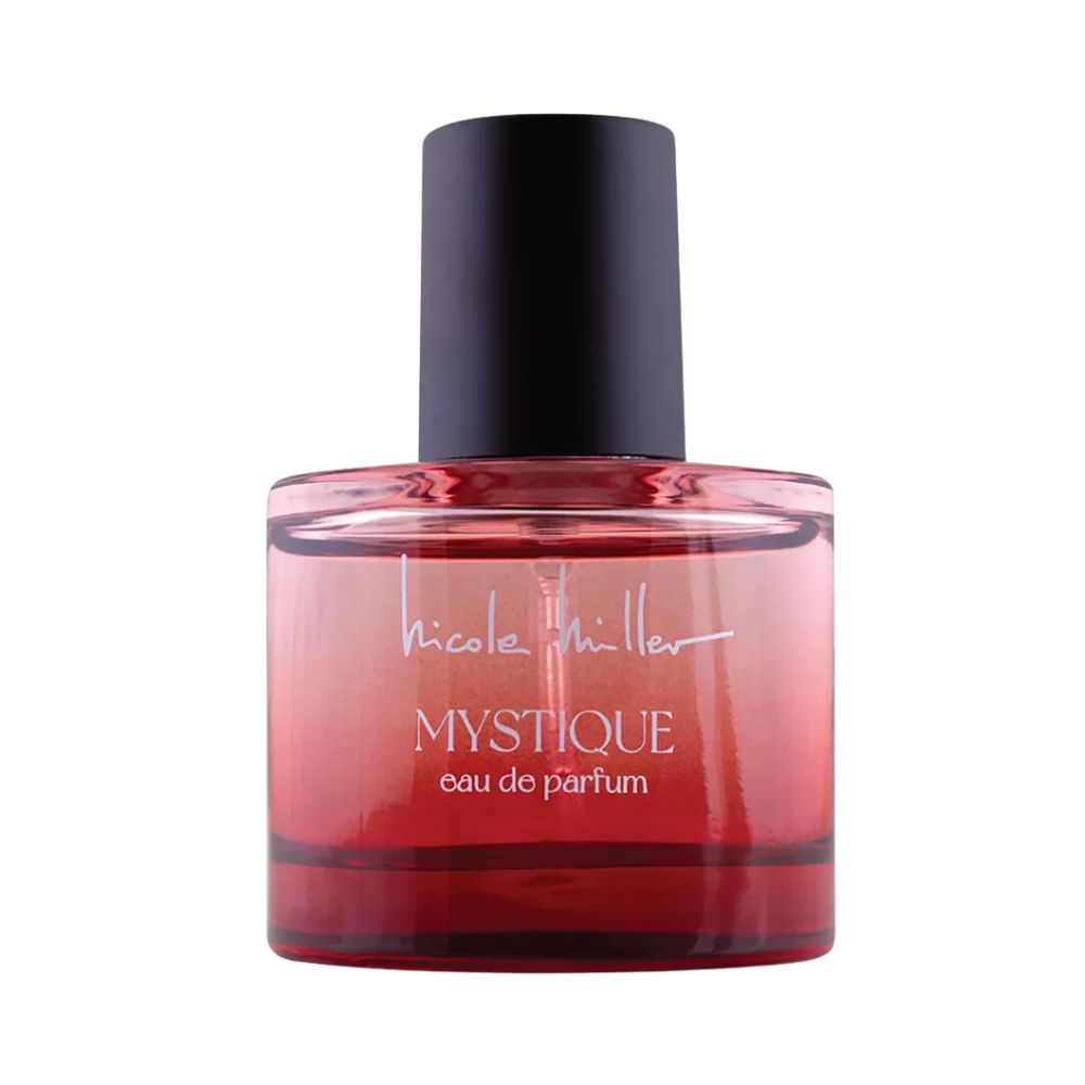Nicole Miller Mystique eau de parfum in a red glass bottle.